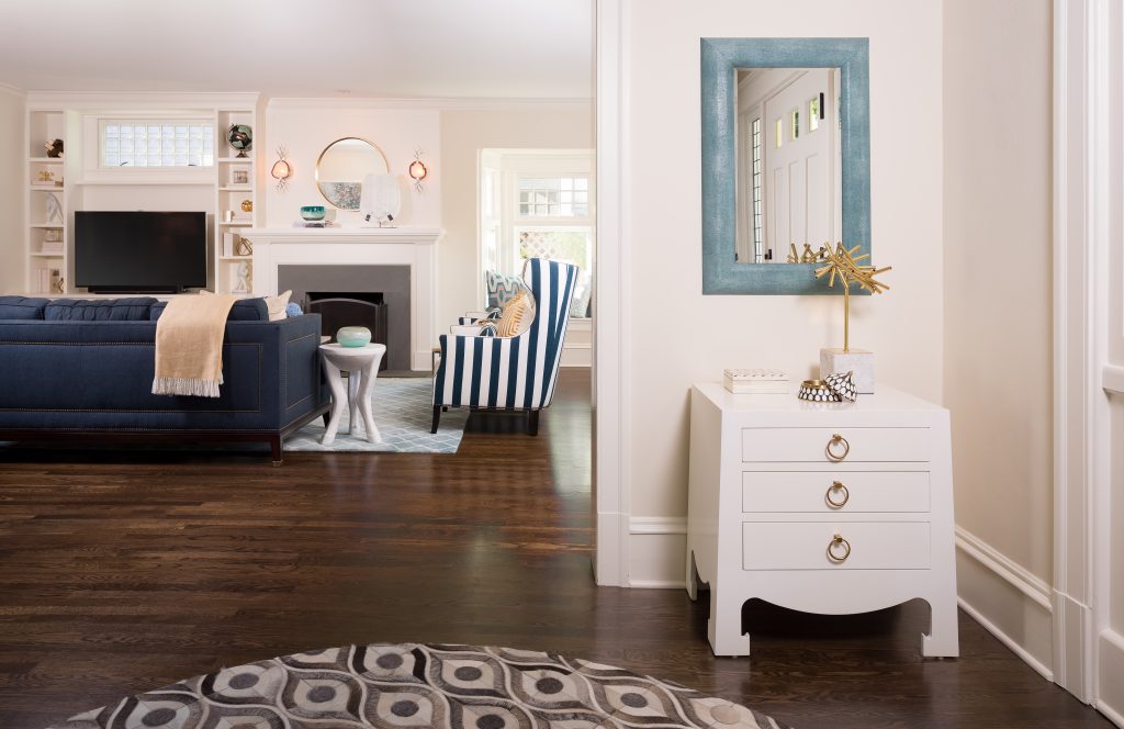 Fearless Style Fit for a Family, Entryway featuring graphic rug, white credenza, blue mirror, coastal style family home