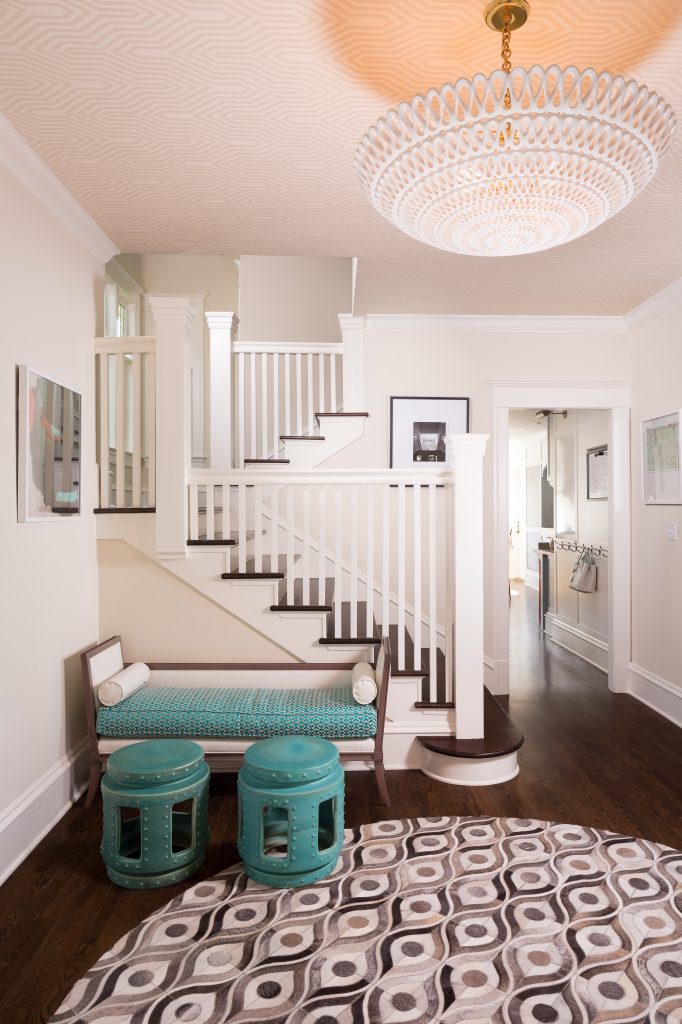 Fearless Style Fit for a Family, Entryway featuring Turquoise stools and bench seating, graphic rug, white railing, coastal style family home