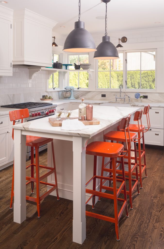 Fearless Style Fit for a Family, Kitchen featuring colorful orange bar stools, black pendant lighting, modern coastal style family home