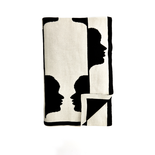 Pulp Design Studios Kismet Lounge Collection Gemini Reversible Throw Blanket in Black and White featuring a graphic pattern of the astrological twins faces