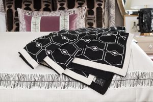 Pulp Design Studios for S Harris textiles, Osaka upholstery textile, globally inspired bedroom decor, Hidalgo drapery, Custom Upholstered Bed, Custom Drapery, Globally inspired home, purple velvet stool, black and white striped arm chair, Kismet Lounge collection