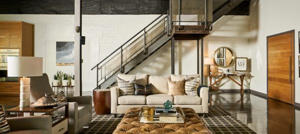 The Loft | a handsome city sanctuary | Pulp Design Studios | Masculine and Handsome warehouse turned city loft | Loft home decor | Open living room | Great room design | Industrial home loft | Leather ottoman | Loft interior design | Dallas home | Eclectic home decor for a handsome loft | Renovation tips | Shelfie | Entry | Foyer style tips | Modern kitchen | Custom kitchen | Open floor plan