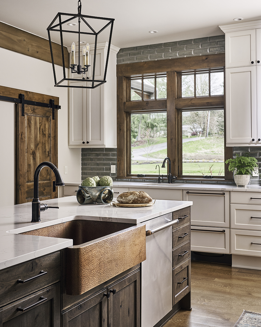 copper sink, thompson traders, oil rubbed bronze, dxv plumbing, ann sacks glass tile, barn door slider, island pendants, windows in kitchen, prep sink design, where to put a prep sink