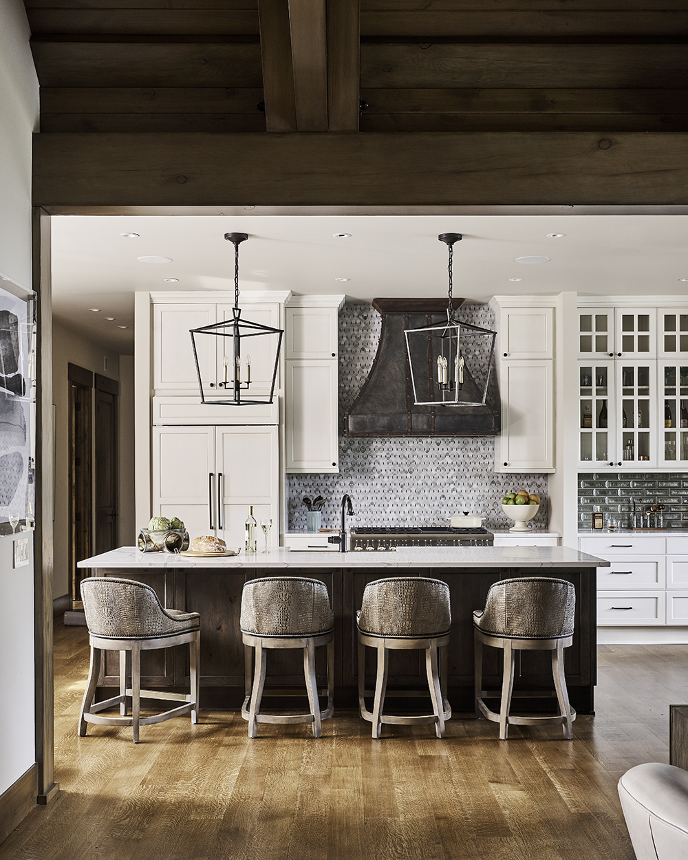 white kitchen design, transitional kitchen design, island with barstools, transitional glass backsplash, black kitchen pendants, kitchen design, kitchen inspiration, seattle kitchen designer, woodinville kitchen designer, wood ceiling, white kitchen wood island