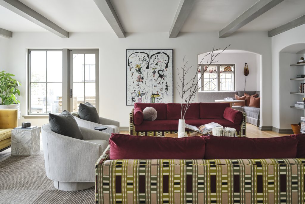 Layered luxury living room with custom furnishings original art and custom interior design details.